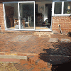 The finished brickwork patio with a curved step down to the lawn