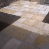 This shows the finished patio and steps with the light coloured stone slabs