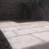 This shows the finished patio with the light coloured stone slabs
